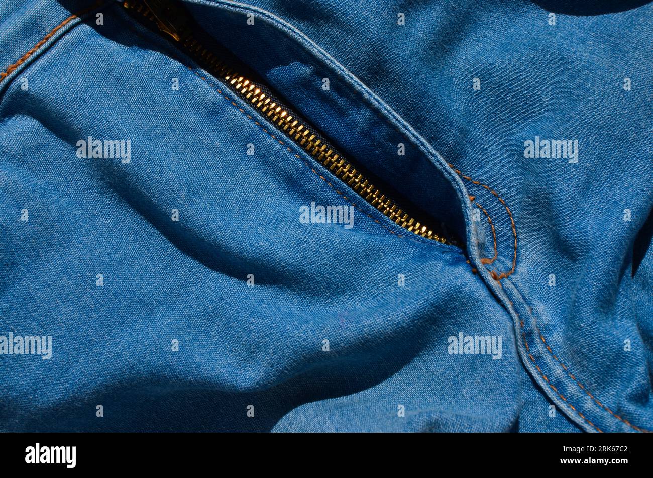 Close-up of a jeans seam, highlighting the perfectly aligned lines that guarantee an impeccable fit. Perfect for fashion and apparel projects. Stock Photo