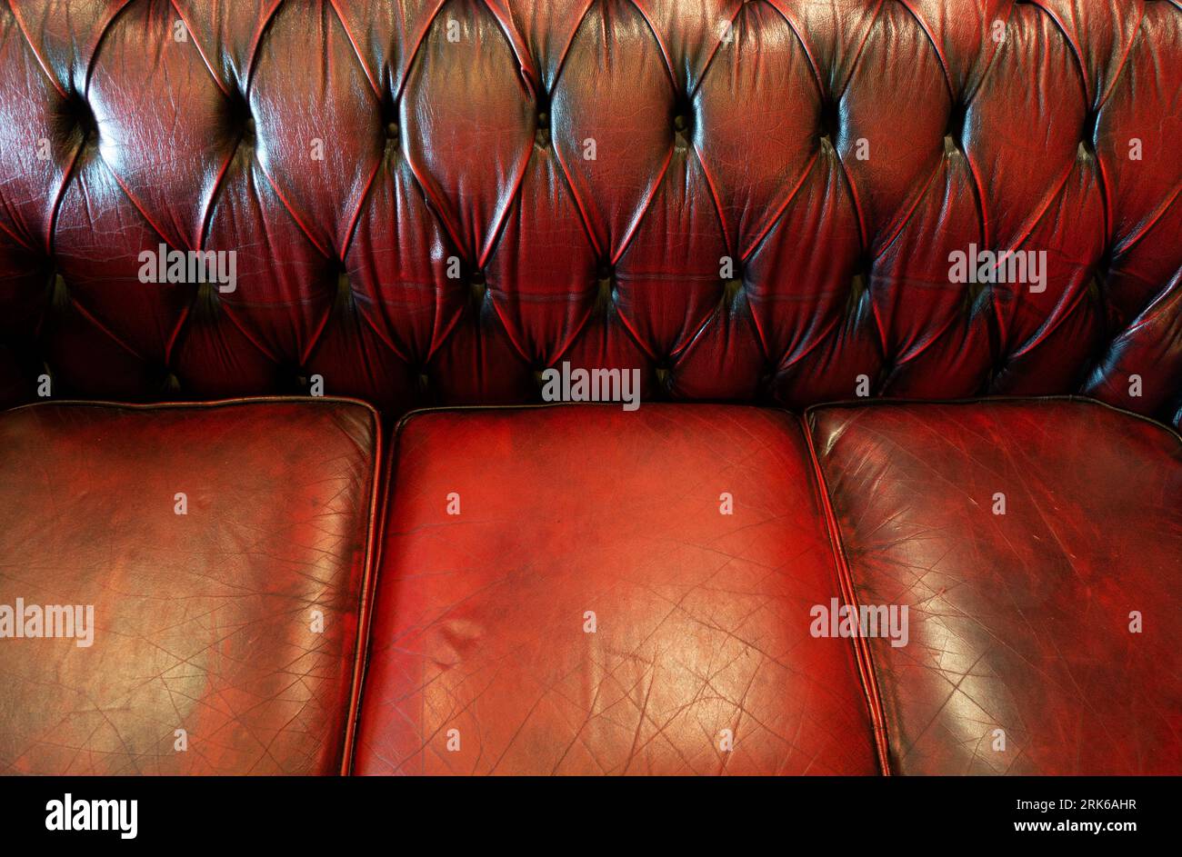 Red Leather Settee Stock Photo - Alamy