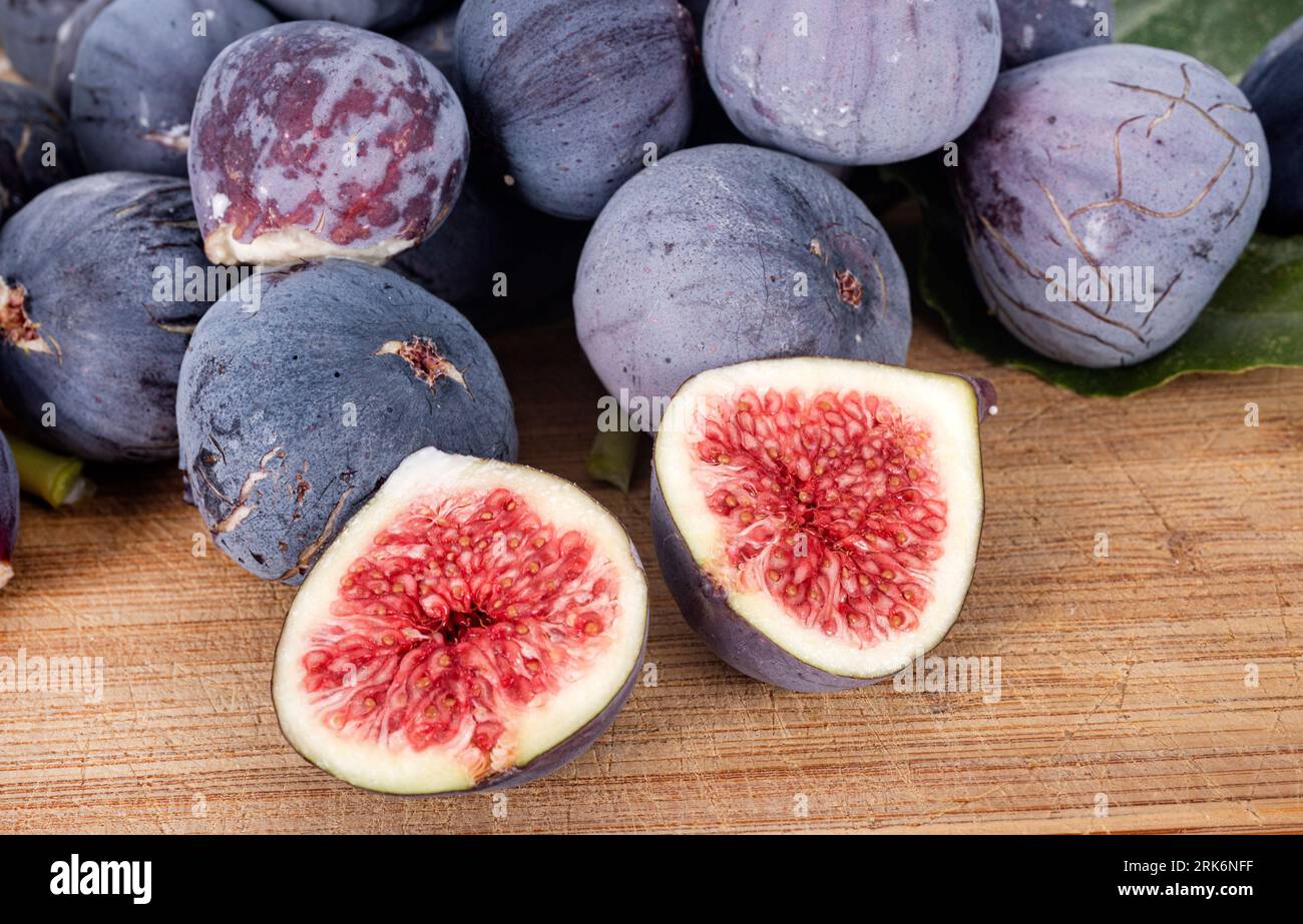 purple figs in front of white background Stock Photo Alamy