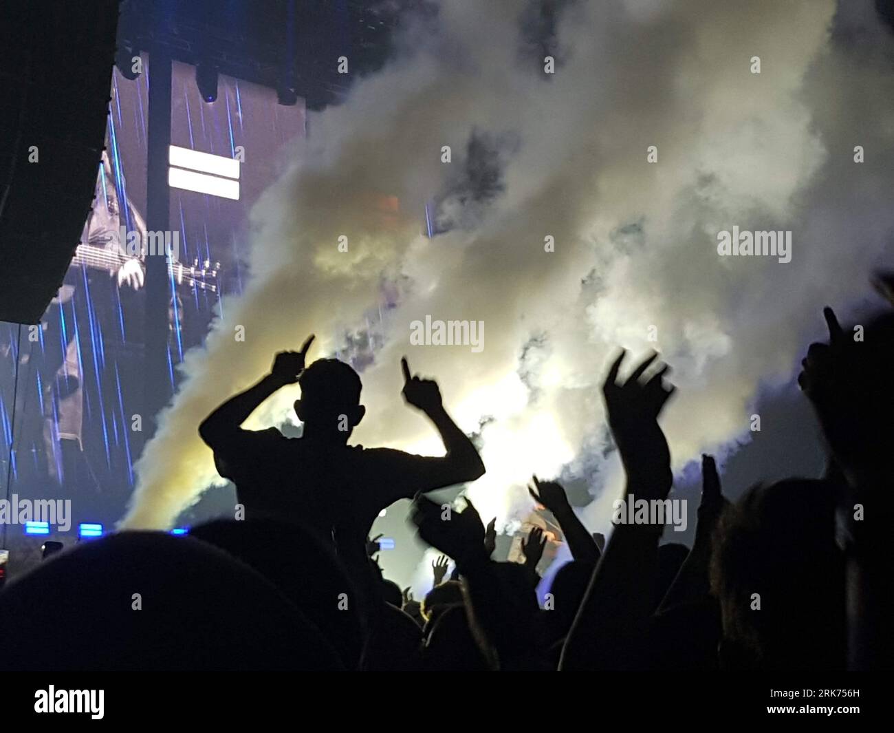 A group of people gather together to watch a spectacular show during a ...