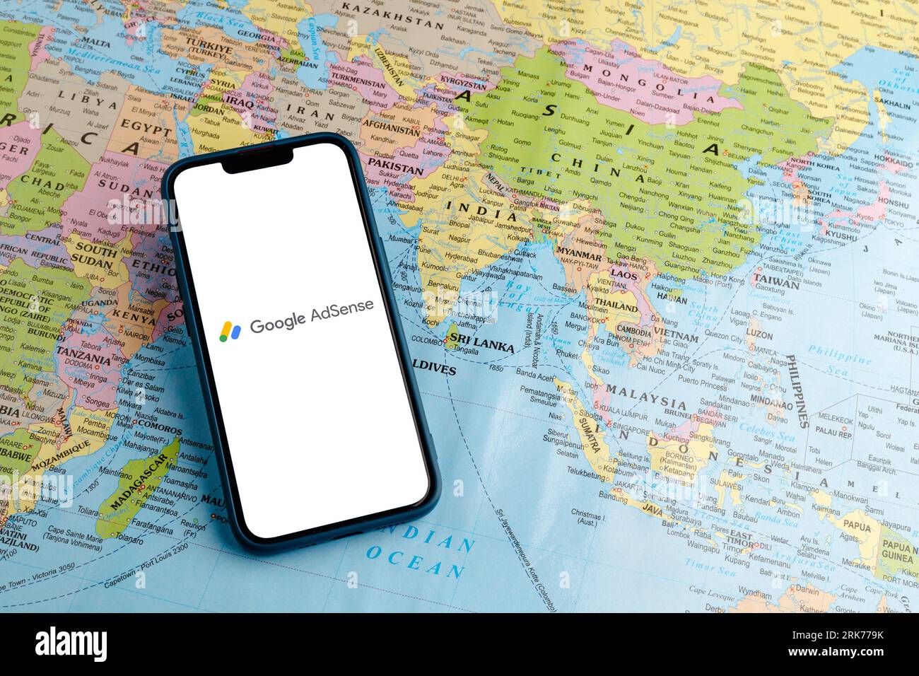 A modern smartphone with a Google Ads logo displayed on the screen. Stock Photo