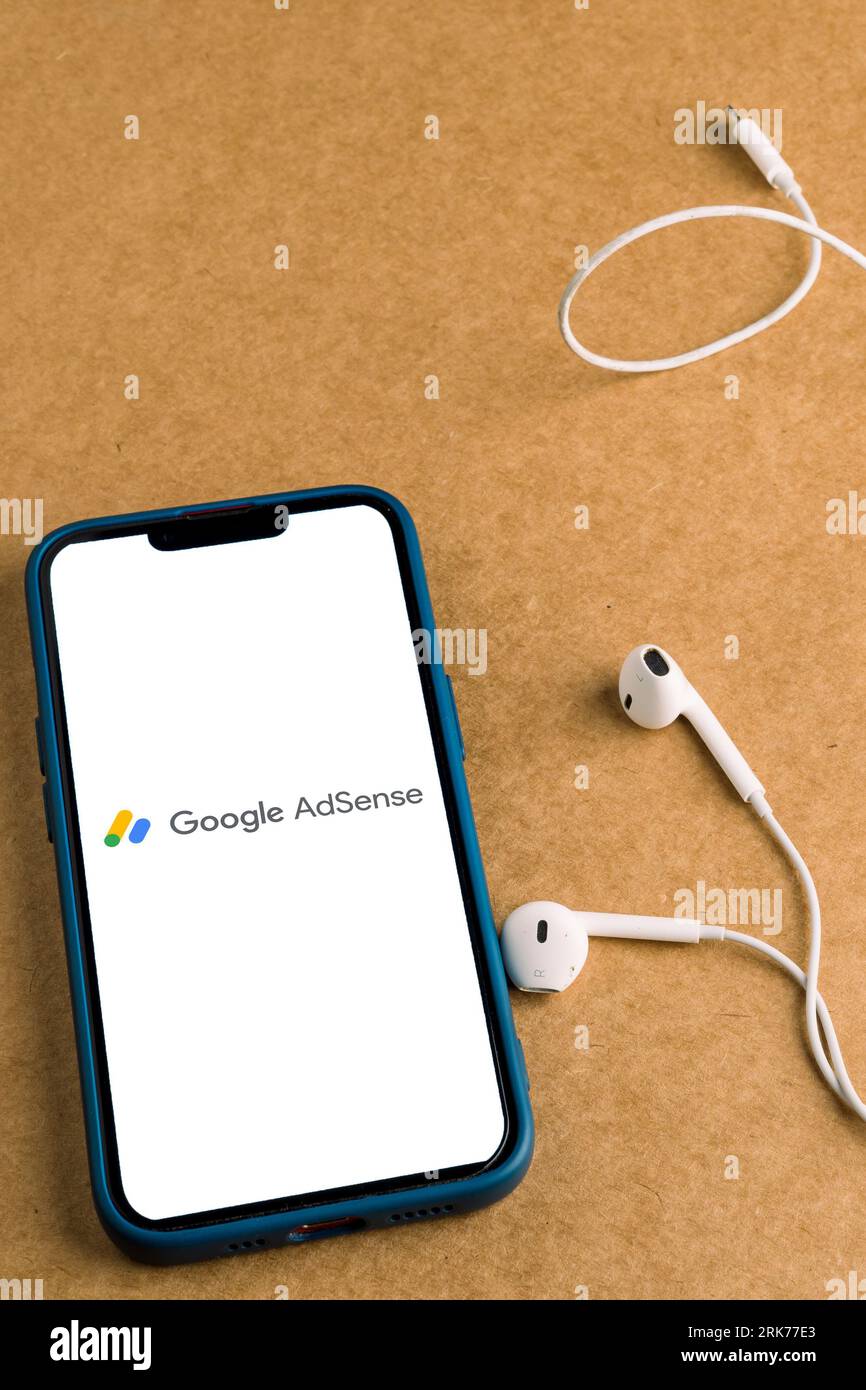 A modern smartphone with a Google Ads logo displayed on the screen. Stock Photo