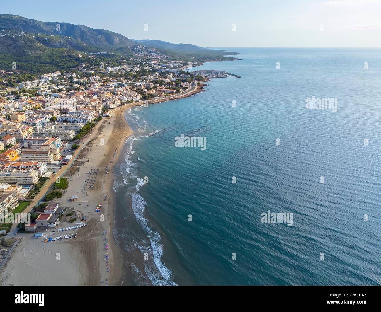 aerial image of the beach of El Cargador in Alcober with the Sierra de Irta Natural Park in the background, drone view, horizontal Stock Photo
