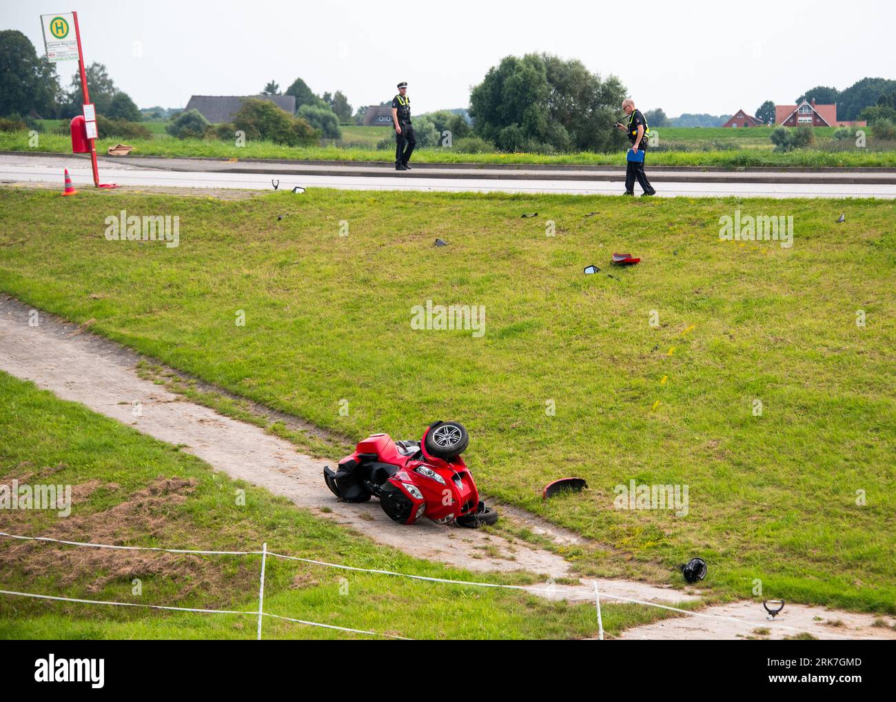 Hamburg, Germany. 24th Aug, 2023. Emergency personnel stand by a quad