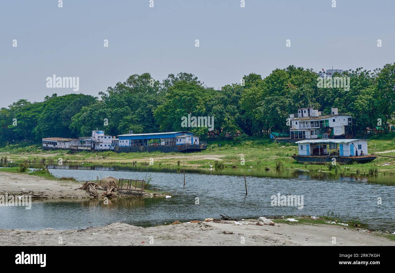 Ferries beached on the banks of the Brahmaputra river Stock Photo