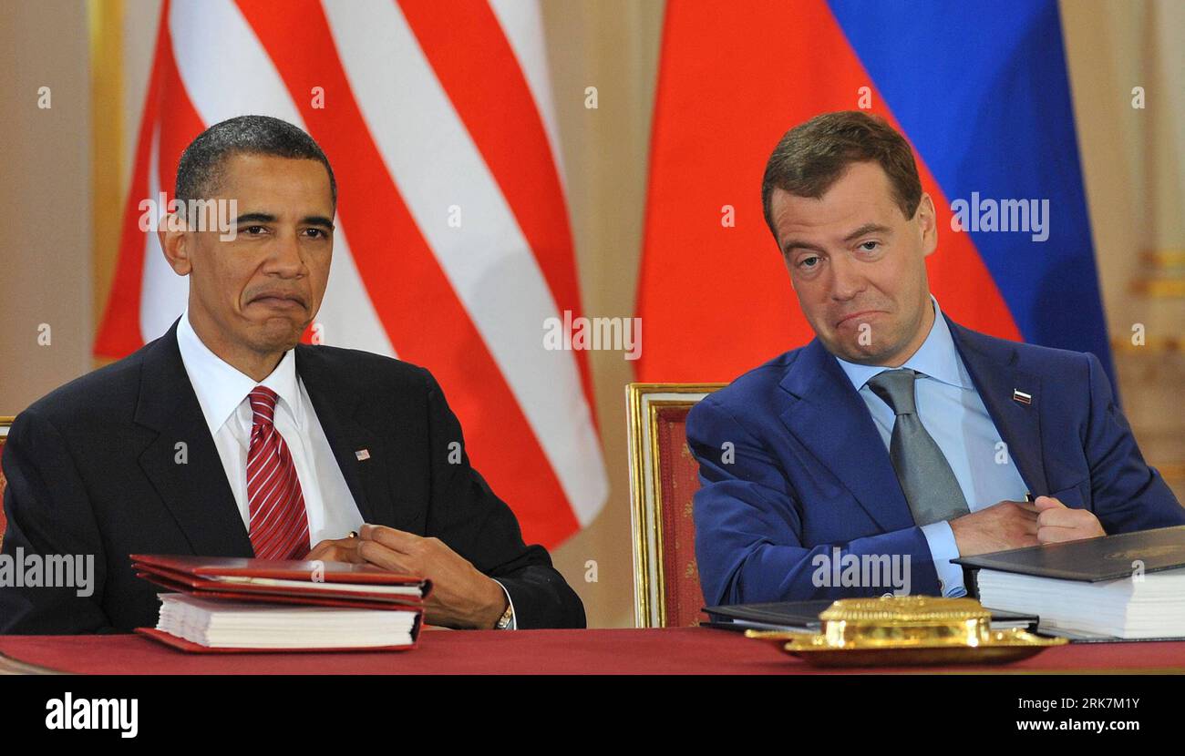 Bildnummer: 53927175  Datum: 08.04.2010  Copyright: imago/Xinhua (100408) -- PRAGUE, April 8, 2010 (Xinhua) -- U.S. President Barack Obama (L) and his Russian counterpart Dmitry Medvedev sign a landmark nuclear arms reduction treaty in Prague, capital of Czech Republic, on April 8, 2010. Under the new pact, the two countries agreed to reduce their deployed nuclear warheads to 1,550 each, or 30 percent below the current level of 2,200, and cut the launchers below 700 each.(Xinhua/Wu Wei) (lyx) (16)CZECH-PRAGUE-RUSSIA-US-TREATY PUBLICATIONxNOTxINxCHN People Politik Prag Abrüstung Abrüstungsgipfe Stock Photo