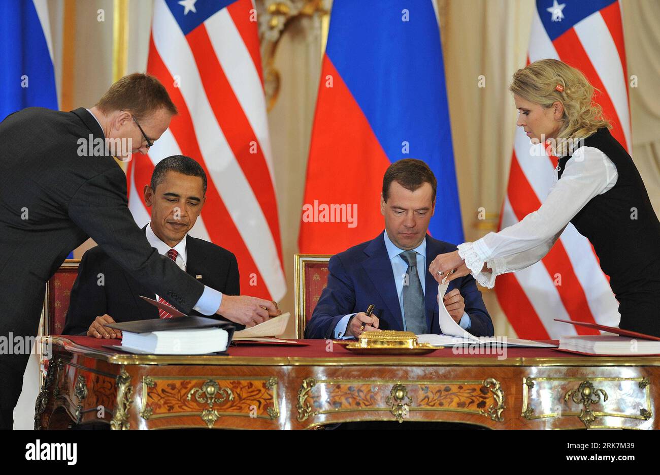 Bildnummer: 53927167  Datum: 08.04.2010  Copyright: imago/Xinhua (100408) -- PRAGUE, April 8, 2010 (Xinhua) -- U.S. President Barack Obama (L) and his Russian counterpart Dmitry Medvedev sign a landmark nuclear arms reduction treaty in Prague, capital of Czech Republic, on April 8, 2010. Under the new pact, the two countries agreed to reduce their deployed nuclear warheads to 1,550 each, or 30 percent below the current level of 2,200, and cut the launchers below 700 each.(Xinhua/Wu Wei) (lyx) (14)CZECH-PRAGUE-RUSSIA-US-TREATY PUBLICATIONxNOTxINxCHN People Politik Prag Abrüstung Abrüstungsgipfe Stock Photo