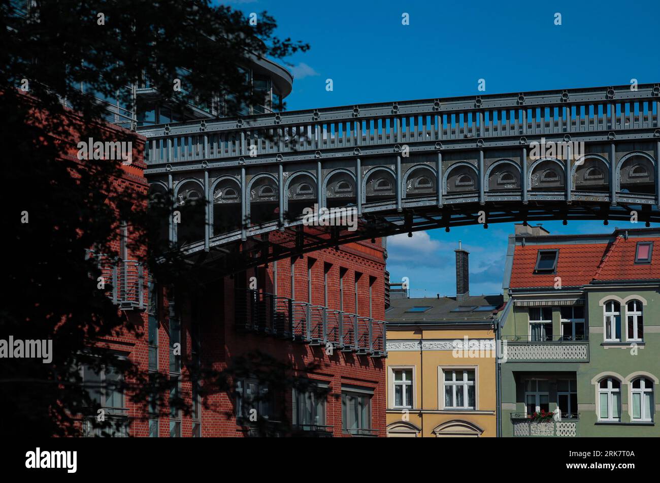 A majestic bridge on the brown brick building of the Stary Browar shopping center in Poznan, Poland Stock Photo