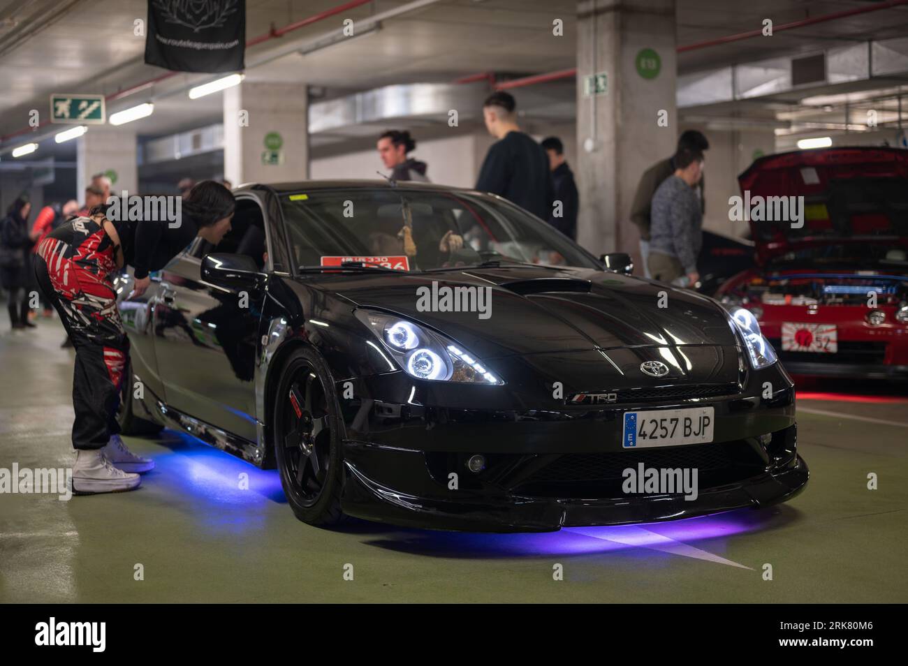Front view of a Japanese sports car from the 90s, a black Toyota Celica