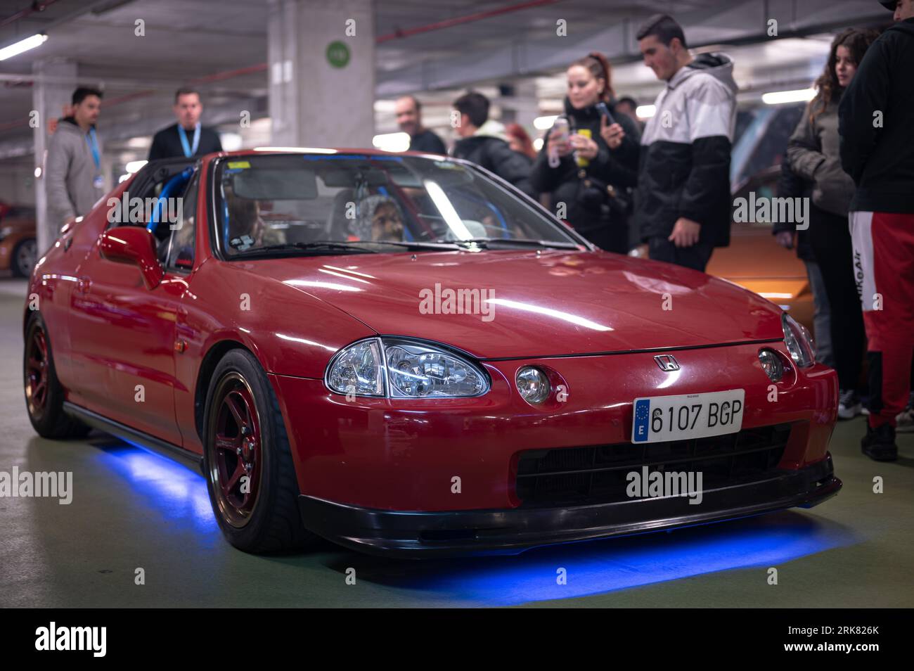 Front view of a red with blue neon Honda Civic CR-X Del Sol tuned by Mugen at a parking rally Stock Photo