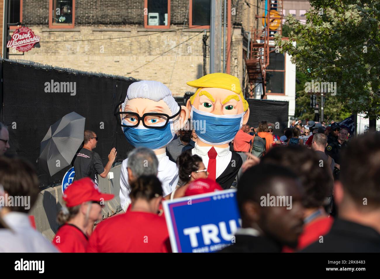 Milwaukee, Wisconsin, USA - August 23, 2023: People in large masked costumes mocking former chief medical advisor to the President of United States Anthony Fauci and former President Donald Trump protest at the entrance to the first Republican Debate for the 2024 Presidential election. Stock Photo