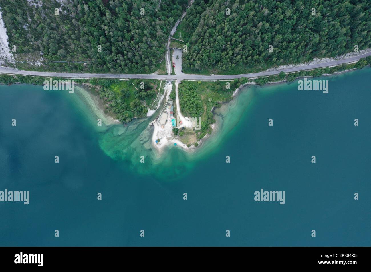 Aerial view of a winding road running along a shoreline Stock Photo - Alamy