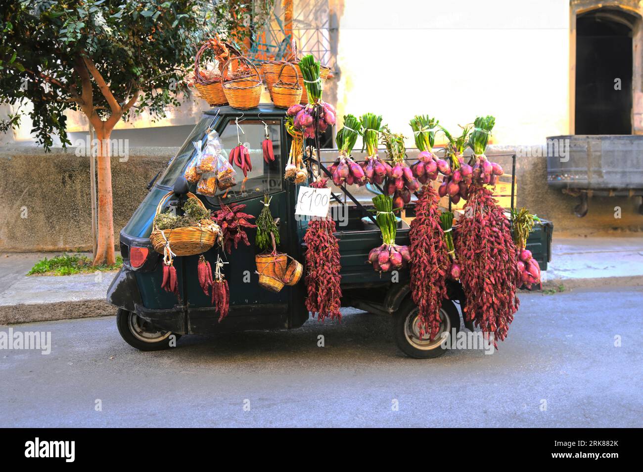 old motorized alley of the Italian tradition decorated with flowers Stock Photo