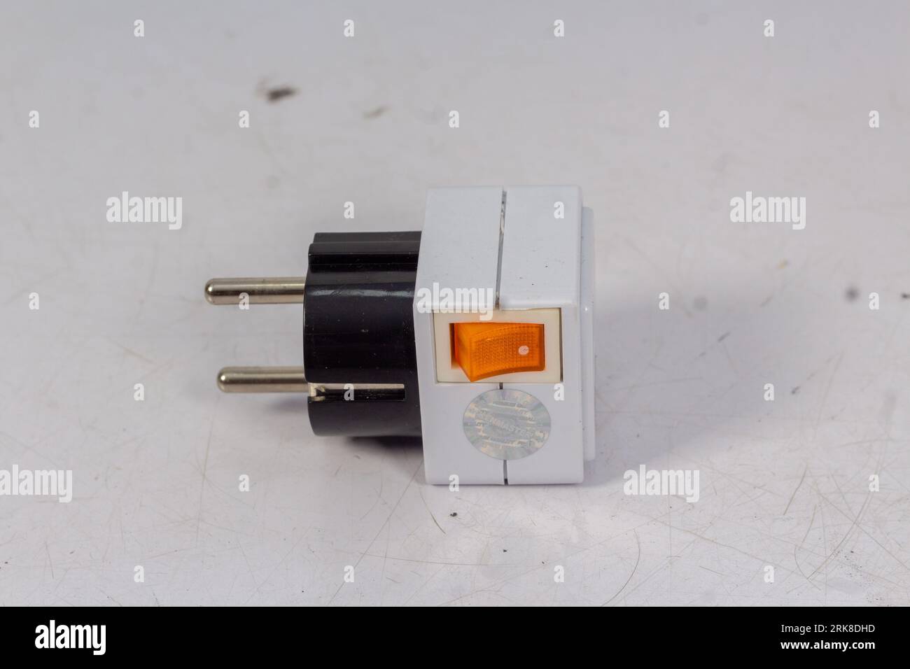 Close up of universal electric socket plug adapters, isolated on white