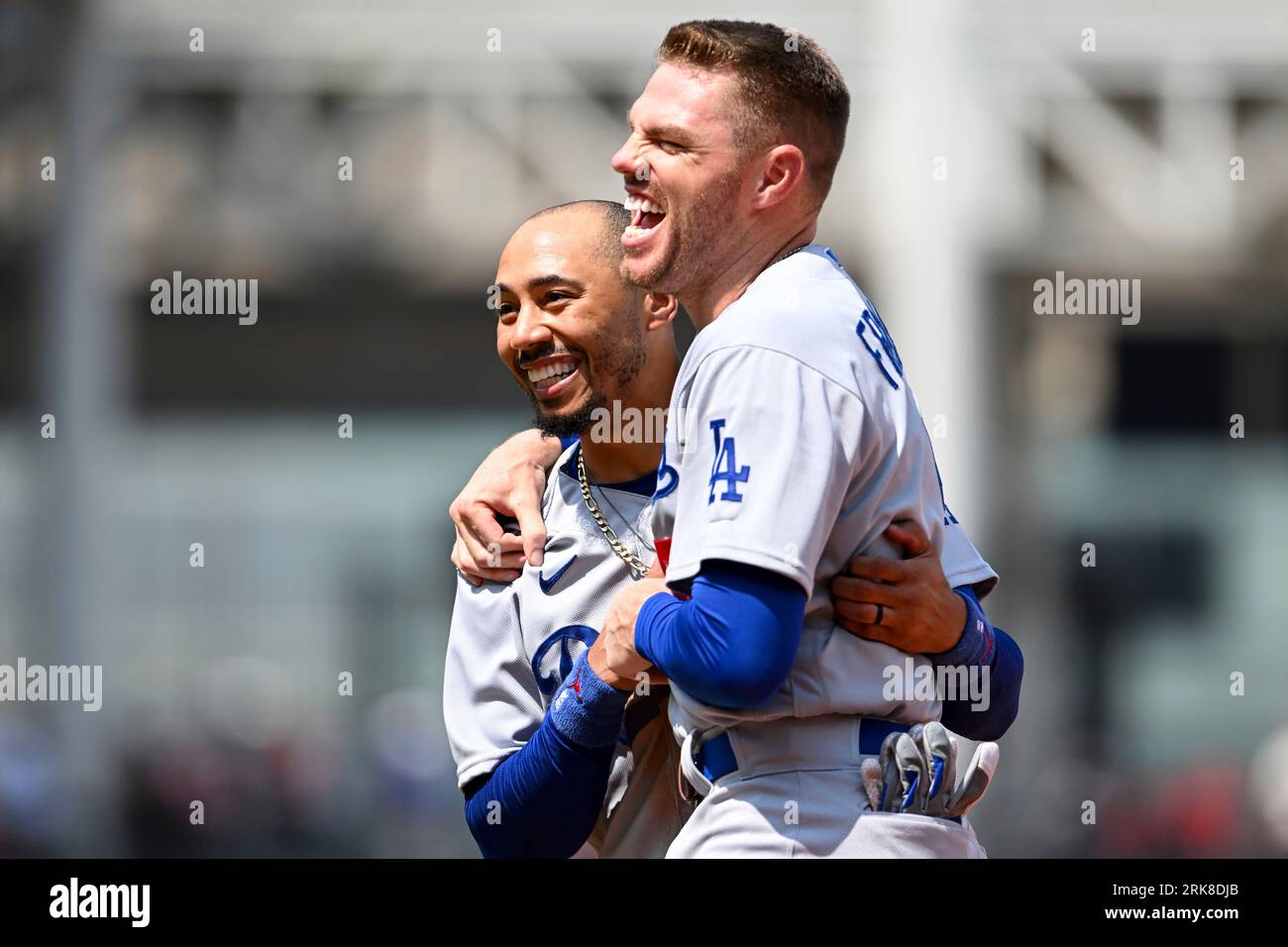 Los Angeles Dodgers' Mookie Betts, left, and Freddie Freeman laugh during  the fourth inning in the continuation of a suspended baseball game against  the Cleveland Guardians, Thursday, Aug. 24, 2023, in Cleveland.
