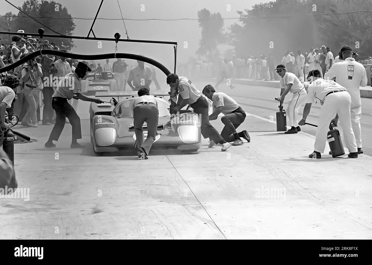 Mark Donohue in a Penske Sunoco Ferrari 512M during a pit stop at the
