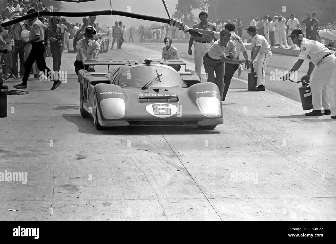 Mark Donohue In A Penske Sunoco Ferrari 512M During A Pit Stop At The mark-donohue-in-a-penske-sunoco-ferrari-512m-during-a-pit-stop-at-the