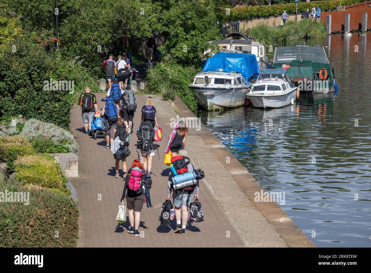Youths walking along River Thames river bank to Reading Festival, Reading, Berkshire, England, United Kingdom, Europe Stock Photo