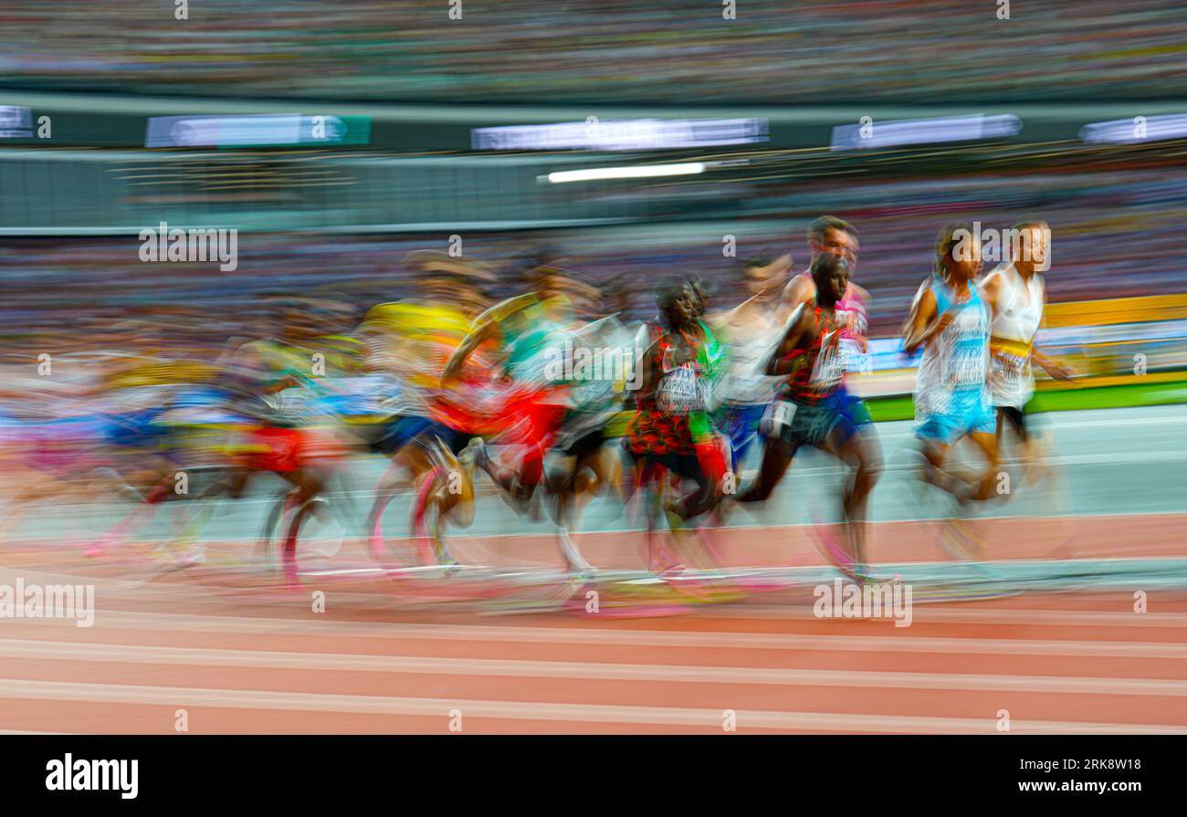 Athletes compete in the Men’s 5000m heat two on day six of the World ...
