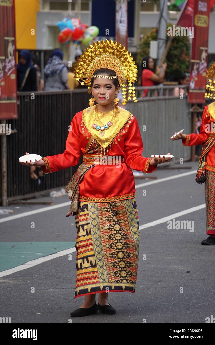 Piring dance from west sumatera at BEN Carnival. This dance is a ritual of gratitude for the people to the gods after getting an abundant harvest Stock Photo