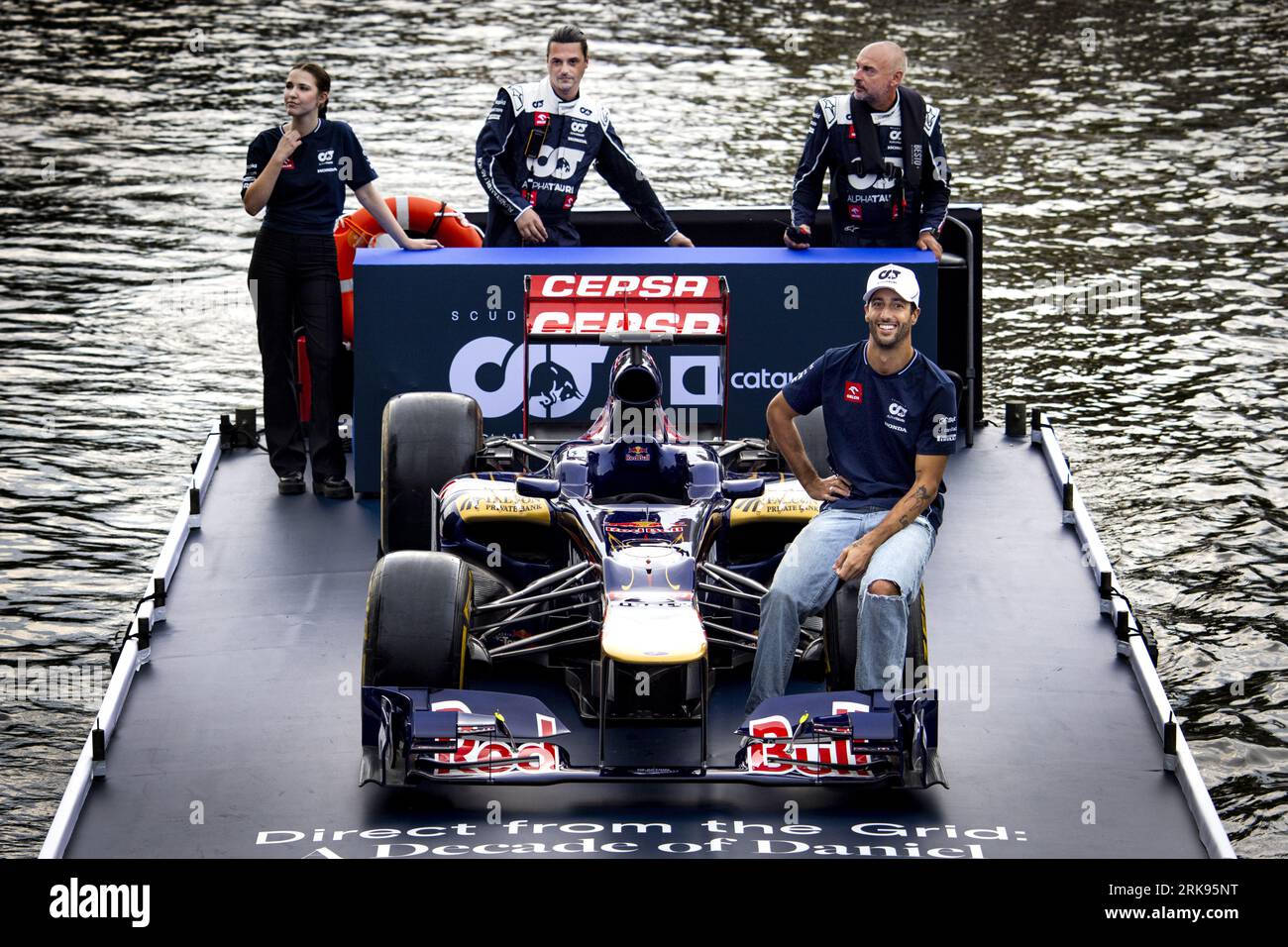 AMSTERDAM - Formula 1 driver Daniel Ricciardo sails on a boat through the  Amsterdam canals with his former STR7 Formula 1 car in which Ricciardo  drove for Torro Rosso in 2012 during