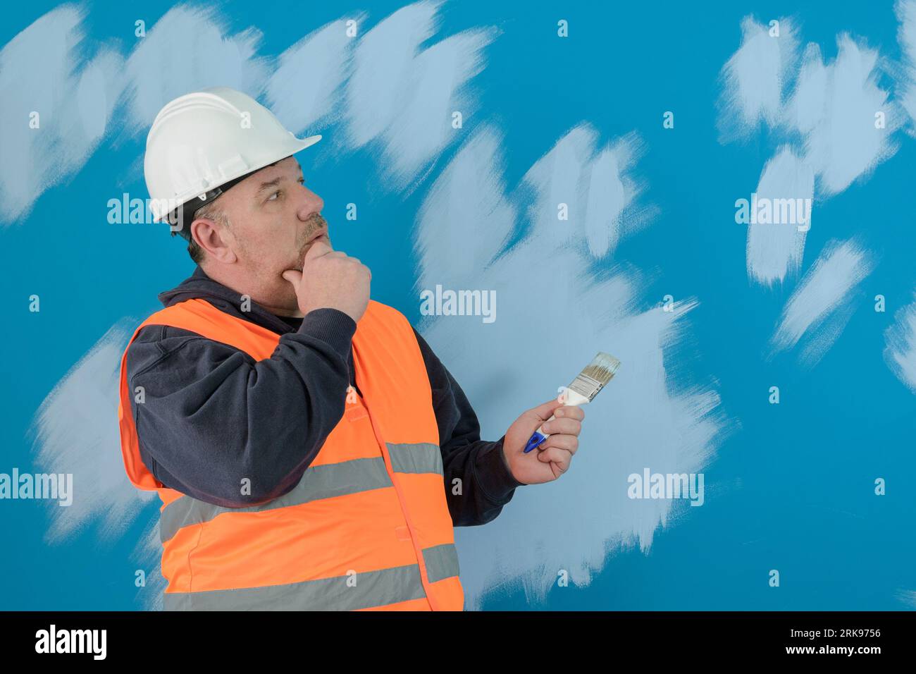 Which color is better Painter at work. Dark blue and light blue Stock