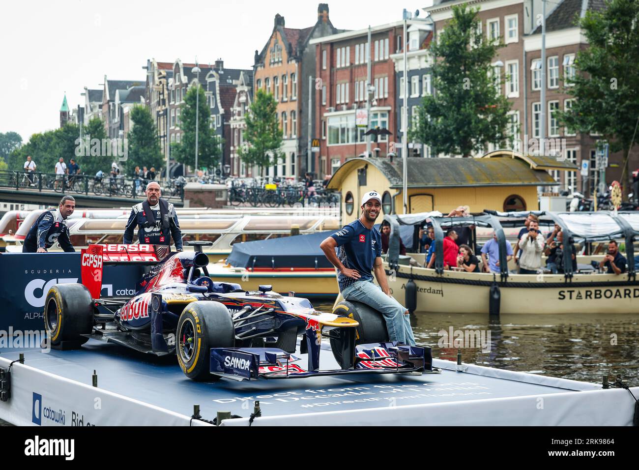 Zandvoort, Pays Bas. 24th Aug, 2023. RICCIARDO Daniel (aus), Scuderia  AlphaTaurii driver, presenting the Catawiki.com #DirectFromTheGrid auction  on a canal of Amsterdam, riding on a boat with his former Toro Rosso STR7