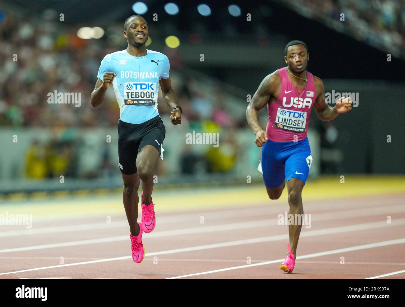 Botswana’s Letsile Tebogo (left) and USA’s Courtney Lindsey compete in