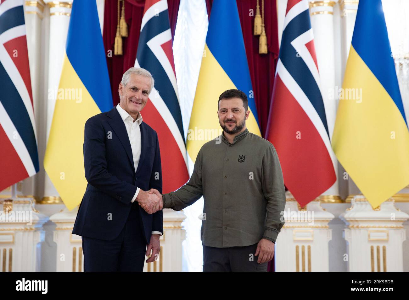 Kyiv, Ukraine. 24th Aug, 2023. Norwegian Prime-Minister Jonas Gahr Store (L) and Ukrainian President Volodymyr Zelensky shake hands during an official celebration of Ukraine's 32nd Independence Day in Sophia Square in Kyiv, Ukraine on Thursday, August 24, 2023. Leaders from Lithuania, and Portugal also visited Kyiv in honor of Ukrainian Independence Day. Photo by Ukrainian President Press Office/ Credit: UPI/Alamy Live News Stock Photo