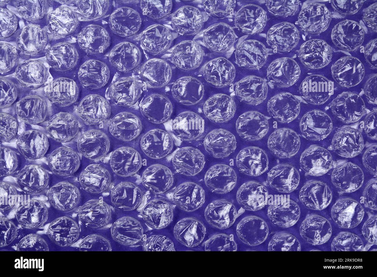 purple bubble plastic wrap surface. plastic with air balls on the