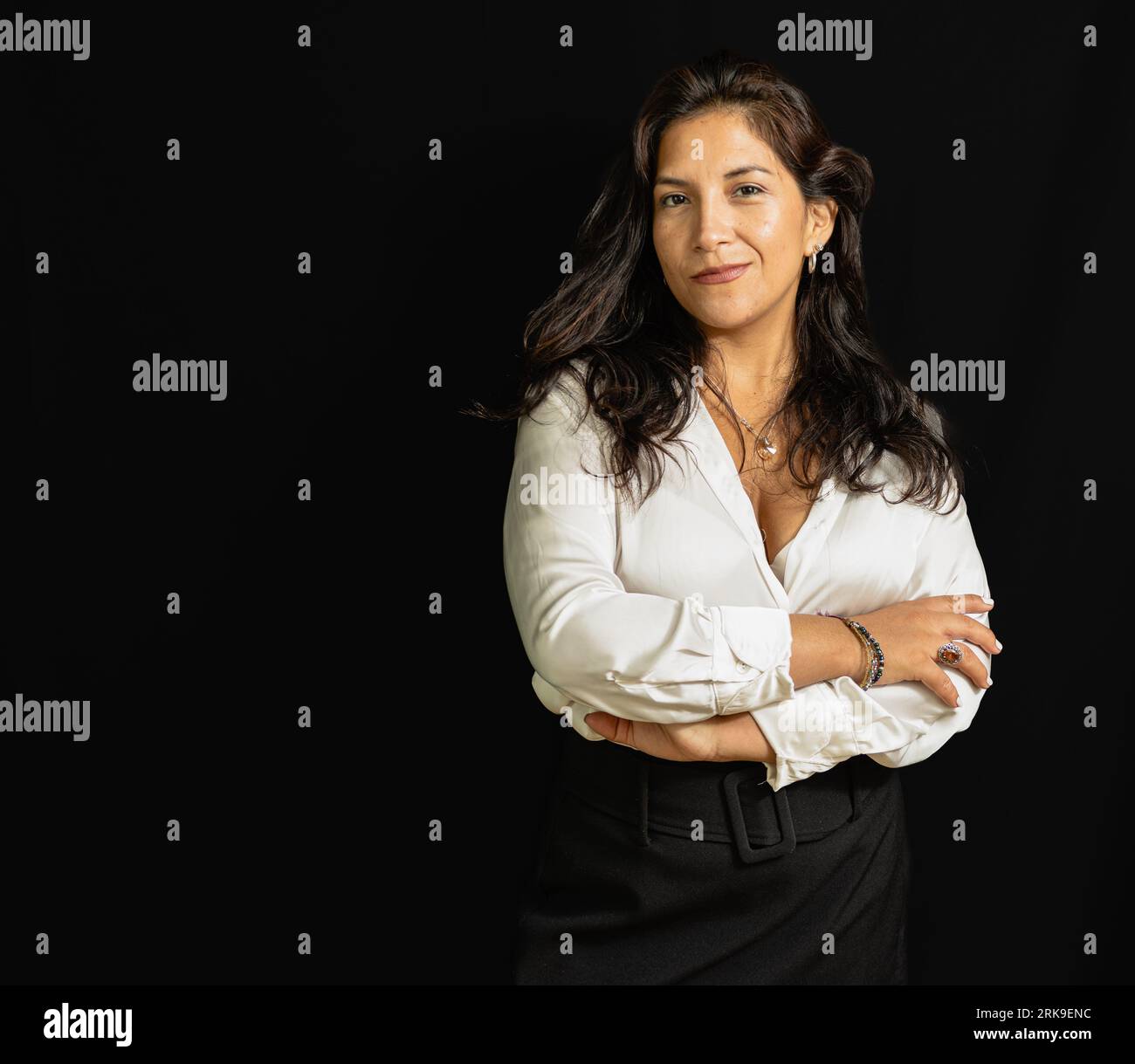 business latin woman in white shirt and black background Stock Photo ...