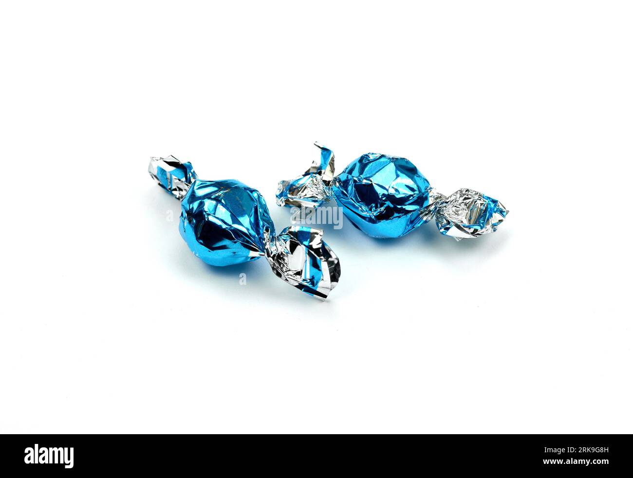 blue wrapped candies isolated on white Stock Photo - Alamy