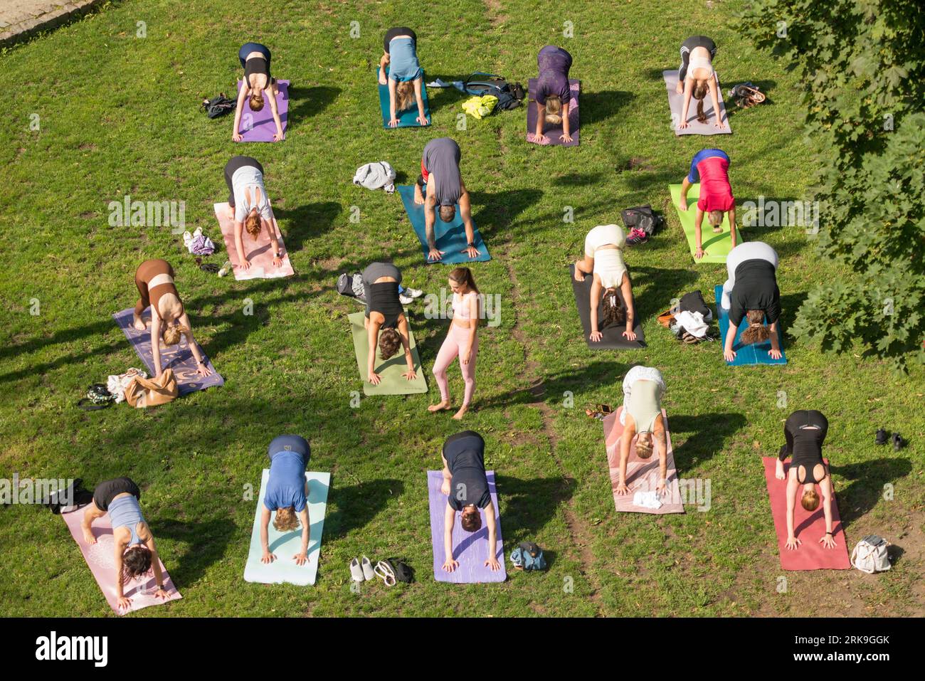 Weekend outdoor yoga class session in Garnizon green space area in Wrzeszcz neighbourhood , Gdansk, Poland, Europe, EU Stock Photo