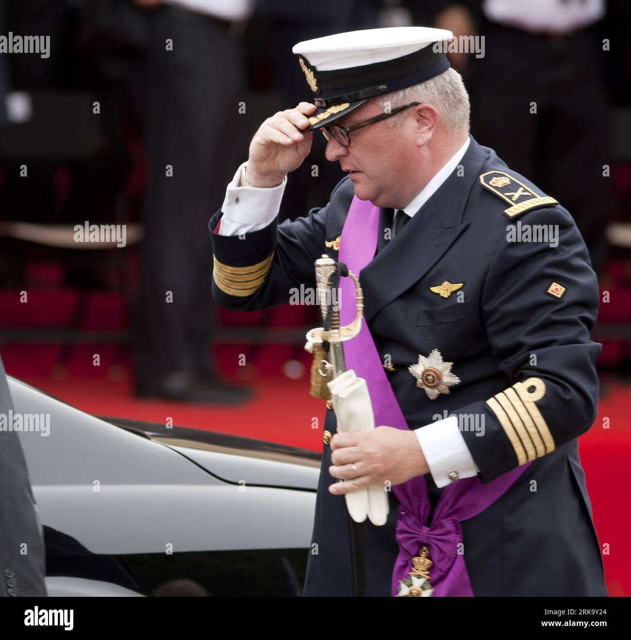 Belgian Prince Laurent (L) is pictured with Princess Claire (R) and her  daughter Princess Louise on the podium during the military parade on the  occasion of Belgium?s National Day in Brussels, Belgium