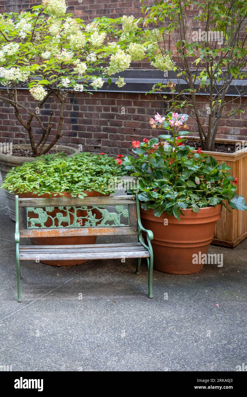 A child's ornate bench on a residential rooftop patio, Murray Hill, 2023, New York City, USA Stock Photo