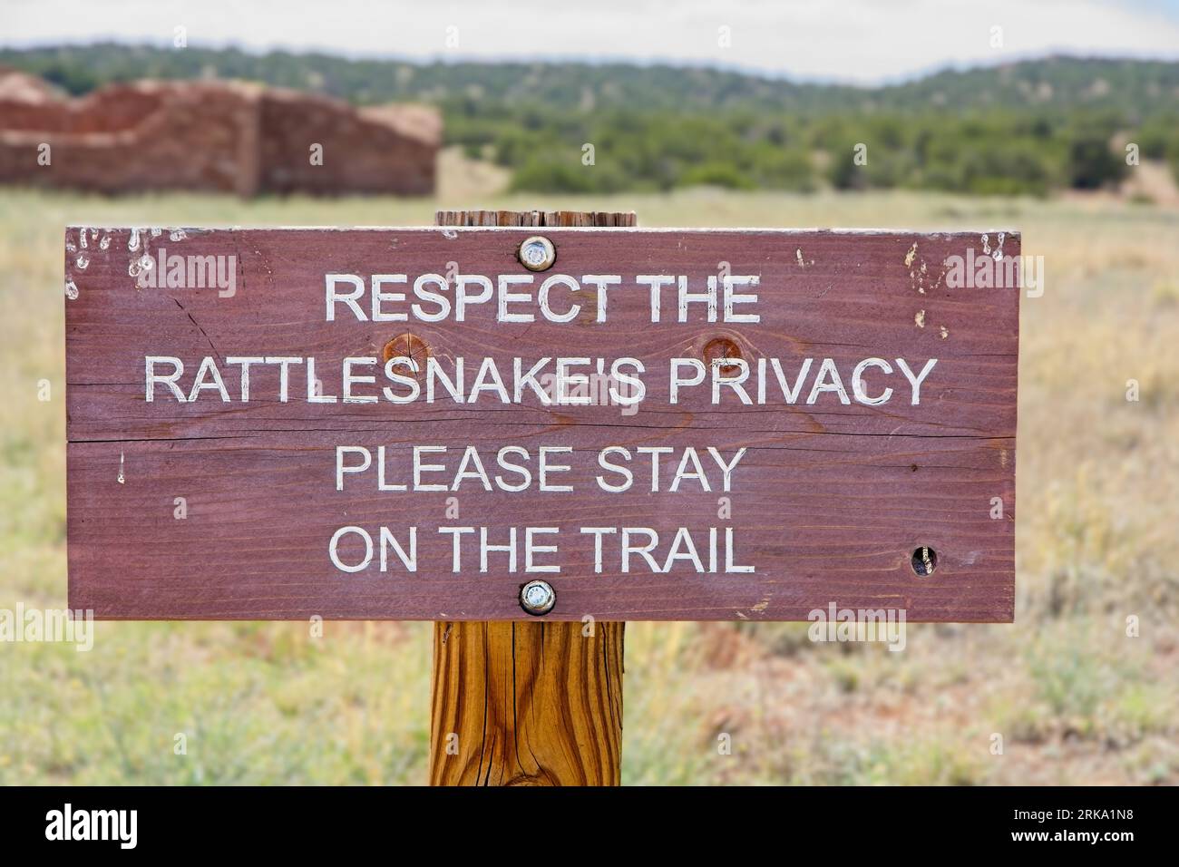 ‘Respect the rattlesnake’ warning sign posted before pueblo ruins of Salinas Pueblo Missions National Monument Stock Photo