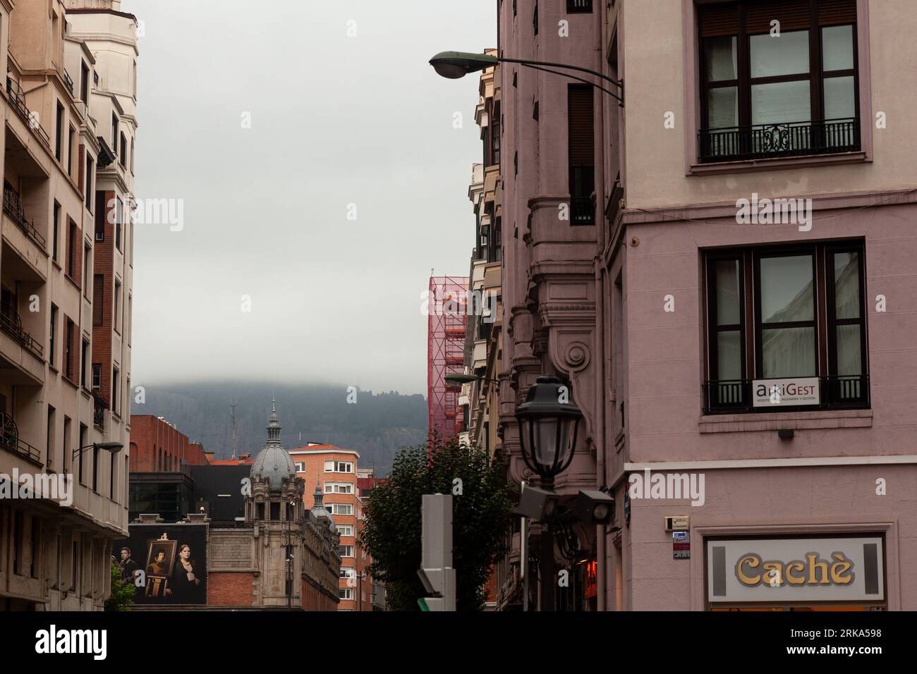 Bilbao, Spain - August 03, 2022: View of the old town of Bilbao on a rainy day, the Azkuna Zentroa on background Stock Photo