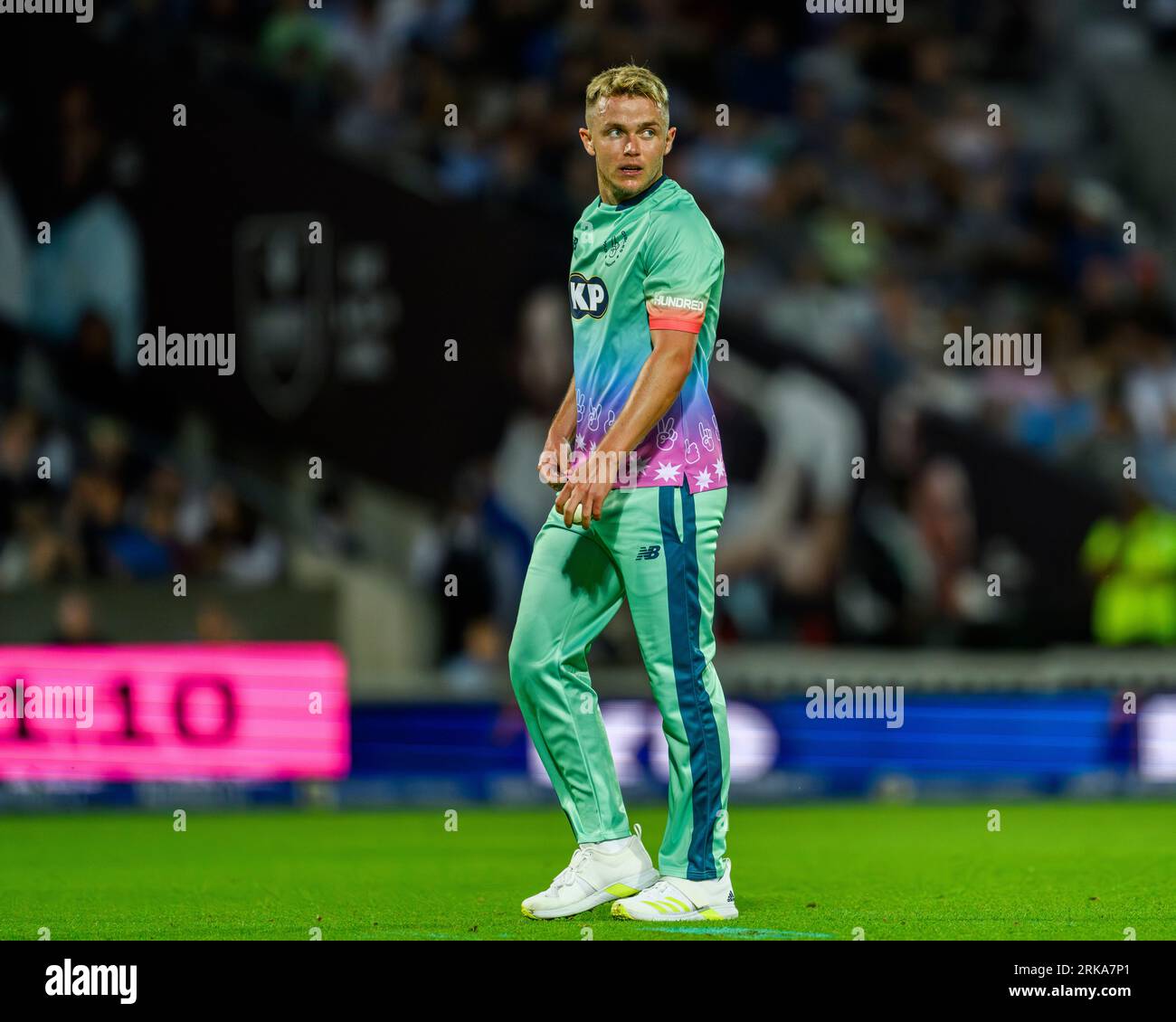 Cricket umpire signaling Six runs Stock Photo - Alamy