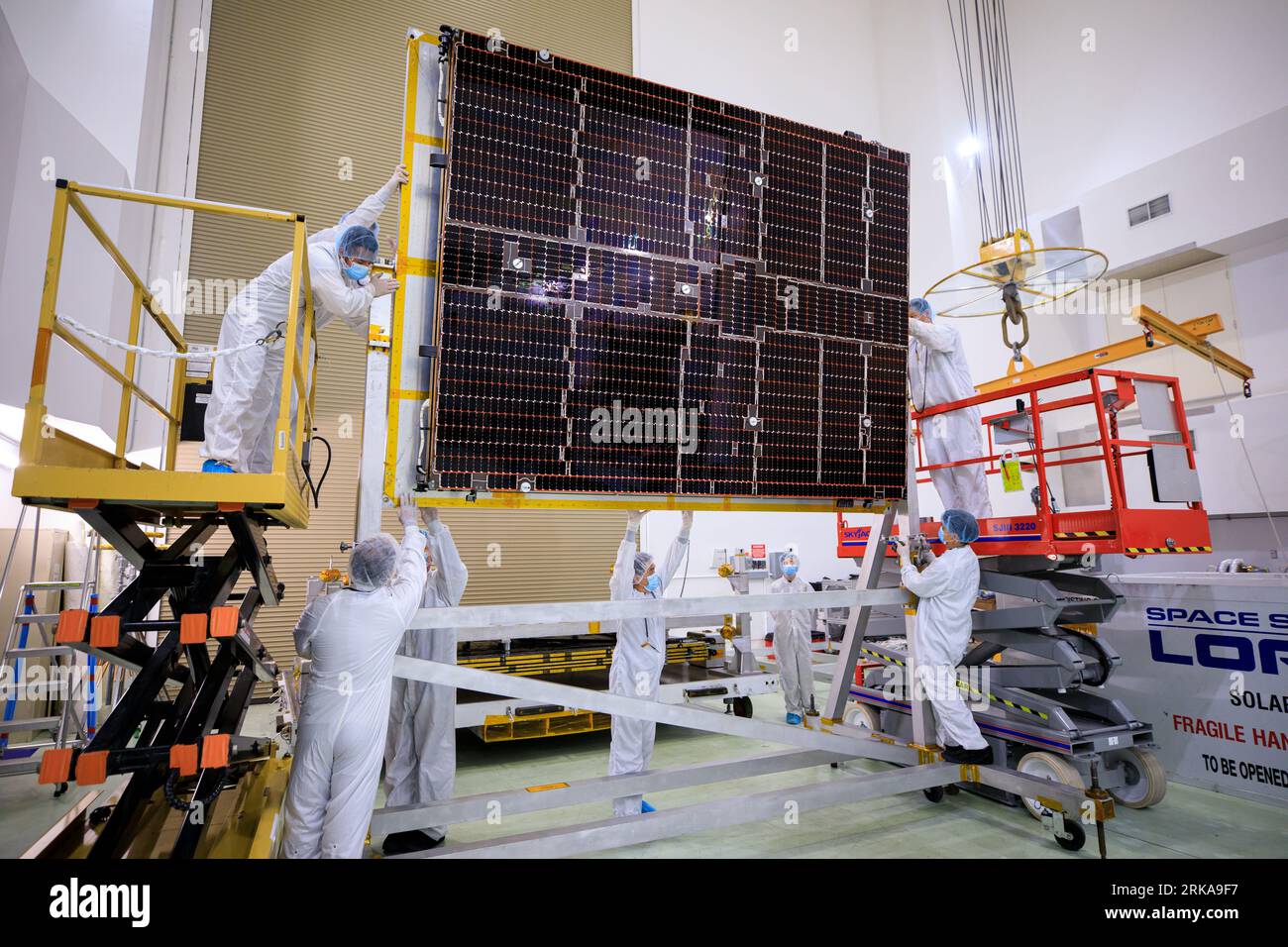 July 18, 2023 - KSC, Florida, USA - A NASA team helps attach solar arrays for the agencys Psyche spacecraft onto a stand inside the Astrotech Space Operations Facility near the agencys Kennedy Space Center in Florida on July 18, 2023. The solar arrays were shipped from Maxar Technologies, in San, Jose, California. They are part of the solar electric propulsion system, provided by Maxar, that will power the spacecraft on its journey to explore a metal-rich asteroid. Psyche will launch atop a SpaceX Falcon Heavy rocket from Launch Complex 39A at Kennedy. Launch is targeted for Oct. 5, 2023. Ridi Stock Photo