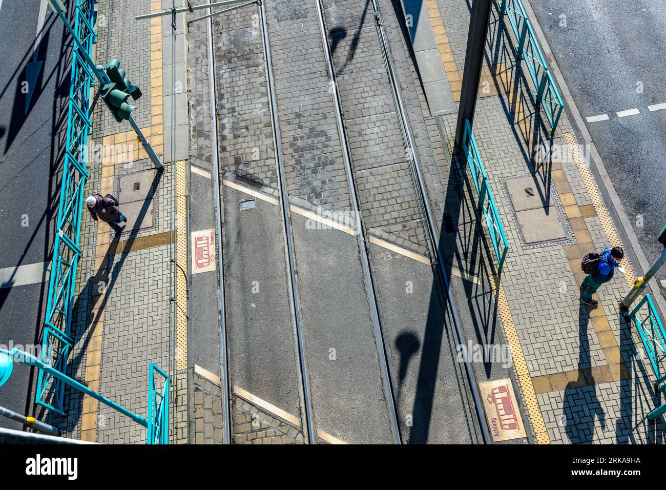Cologne, Germany - February 12, 2014: aerial of streetcar stop with waiting passenger. Stock Photo