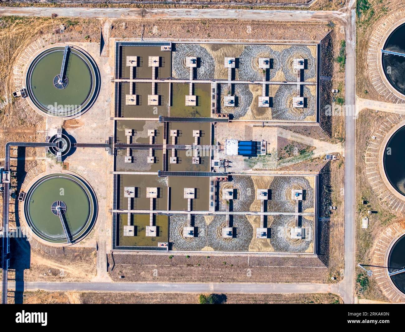 Wastewater treatment plant and system operators remove pollutants from domestic and industrial waste, travels through sewer pipes to treatment plants Stock Photo