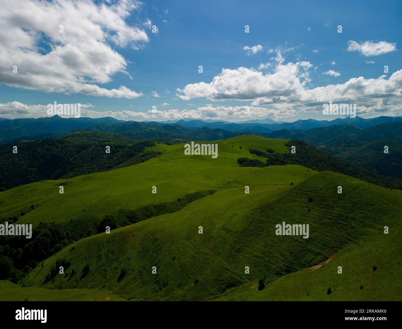 An aerial view of green mountains on a sunny day Stock Photo - Alamy