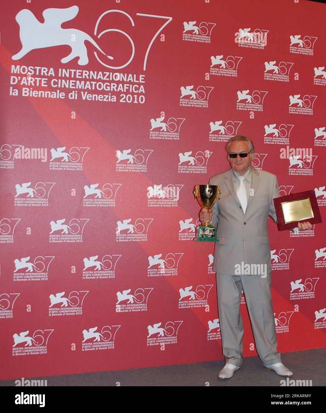 VENICE, Sept. 11, 2010 (Xinhua) -- Polish film director Jerzy Skolimowski holds the Volpi Cup for best actor on behalf of actor Vincent Gallo during a photocall following the awards ceremony of the 67th Venice film festival in Venice, capital of Italy, on September 11, 2010. (Xinhua/Silvia Cesari) ITALY-VENICE FILM FESTIVAL-AWARDS PUBLICATIONxNOTxINxCHN Stock Photo