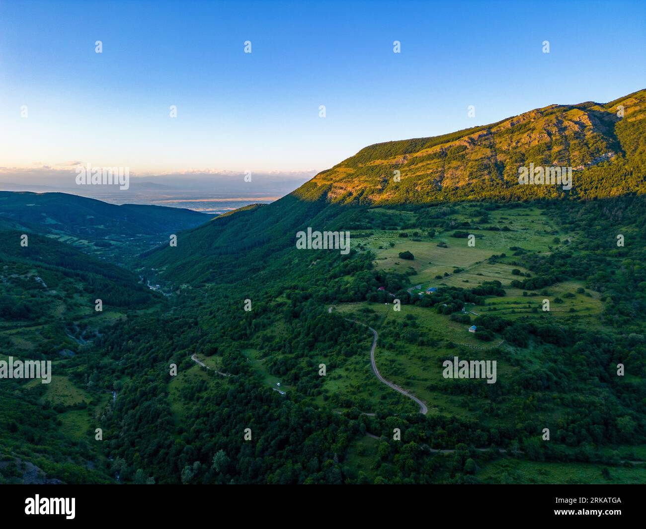 An aerial view of green mountains on a sunny day Stock Photo - Alamy