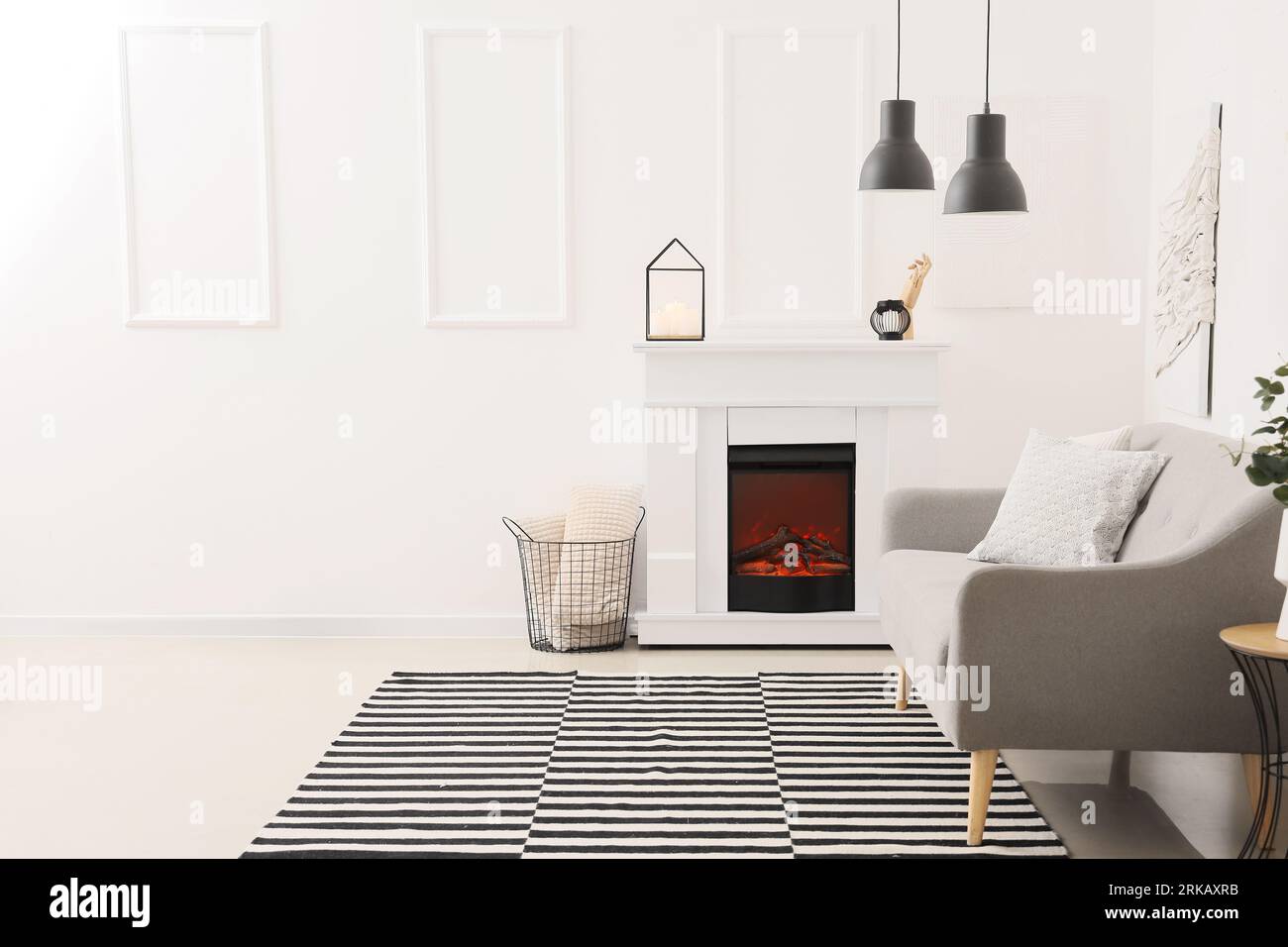 Interior of modern living room with stylish fireplace and sofa Stock ...