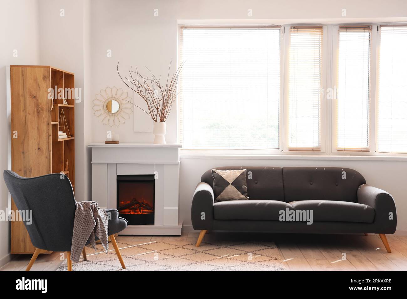 Interior of modern living room with stylish fireplace and sofa Stock ...