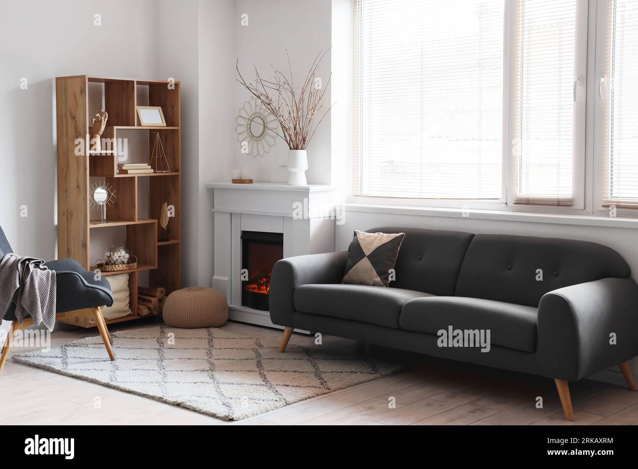 Interior of modern living room with stylish fireplace and sofa Stock ...