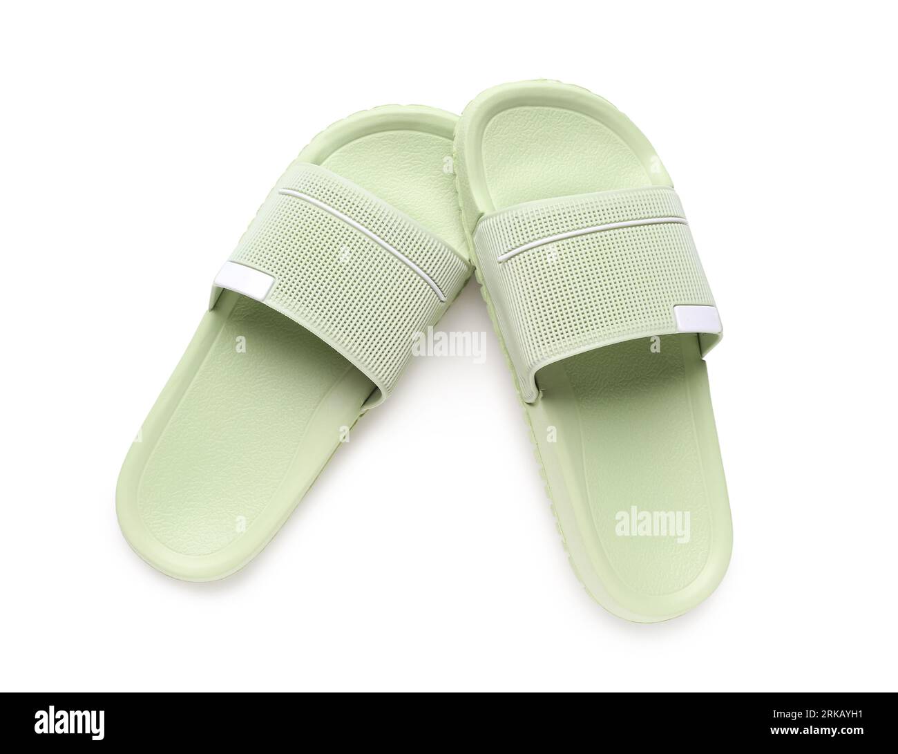 Green female flip flops on white background Stock Photo - Alamy