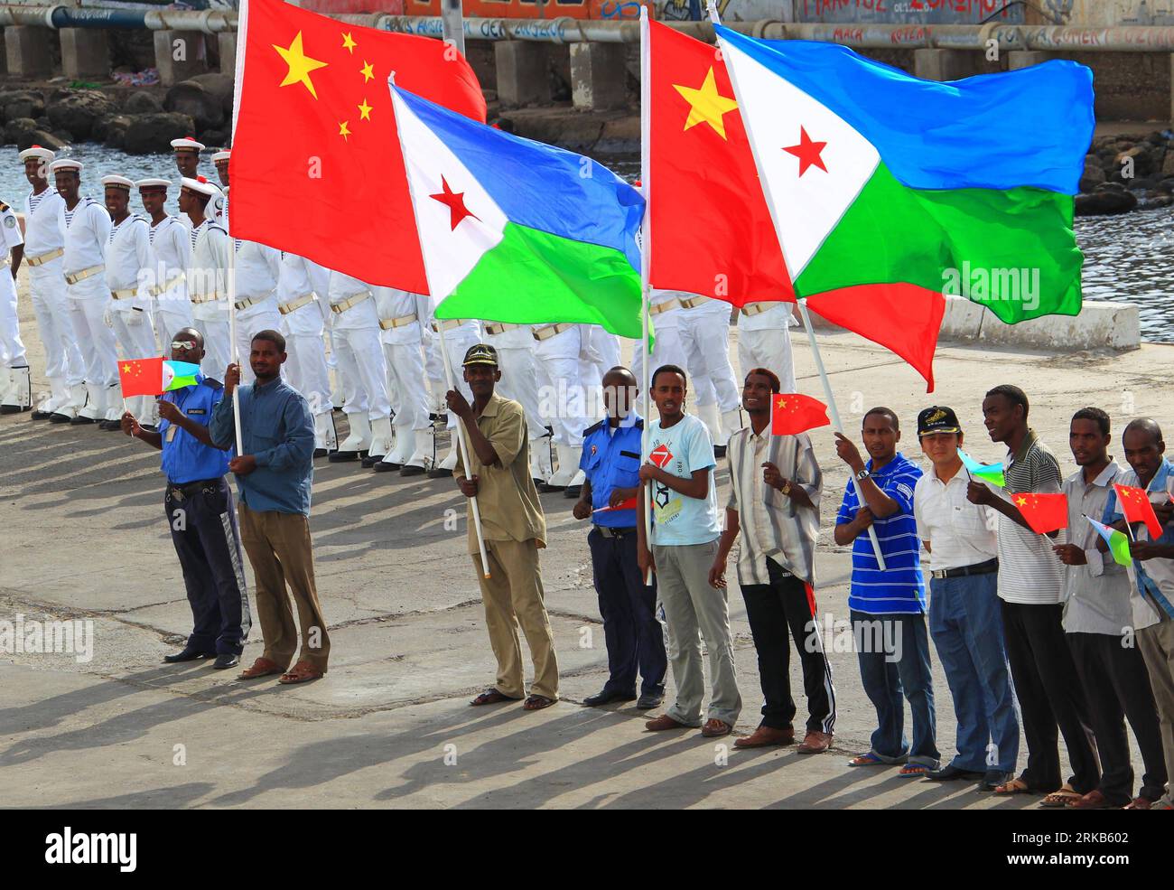 Bildnummer: 54485735  Datum: 29.09.2010  Copyright: imago/Xinhua (100929) -- DJIBOUTI, Sept. 29, 2010 (Xinhua) -- wave national flags of China and Djibouti in front of China s hospital ship Peace Ark at the port of Djibouti, Sept. 29, 2010. The Peace Ark left for Kenya on Wednesday after providing medical services for local residents in Djibouti for a week. (Xinhua/Zha Chunming) (nxl) DJIBOUTI-CHINA-HOSPITAL SHIP-PEACE ARK-DEPARTURE PUBLICATIONxNOTxINxCHN Gesellschaft Friedensschiff Abschied Verabschiedung Schiff kbdig xsk 2010 quer  Hospitalschiff Krankenhausschiff    Bildnummer 54485735 Date Stock Photo