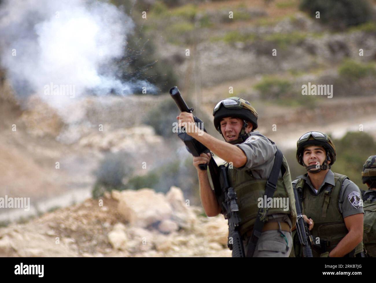 Israeli soldier tear gas grenade hi-res stock photography and
